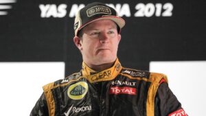 Kimi Raikkonen stands on the podium after winning the 2012 Abu Dhabi Grand Prix