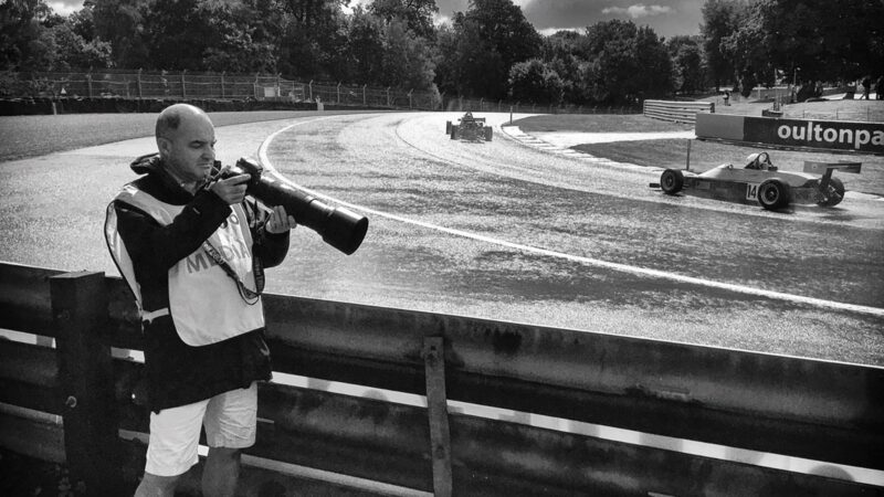 Simon Arron inspects a picture on his camera at Oulton Park