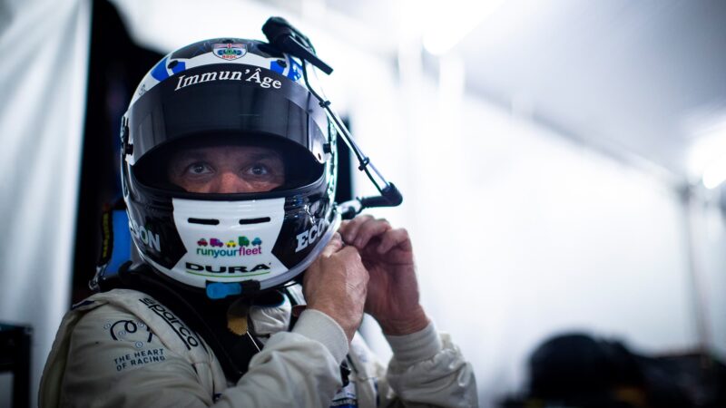 Darren Turner puts helmet on during 2023 Daytona 24 Hours