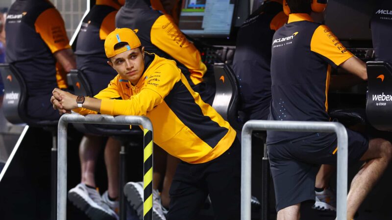 Lando Norris leans on McLaren pitwall in 2023 Bahrain testing