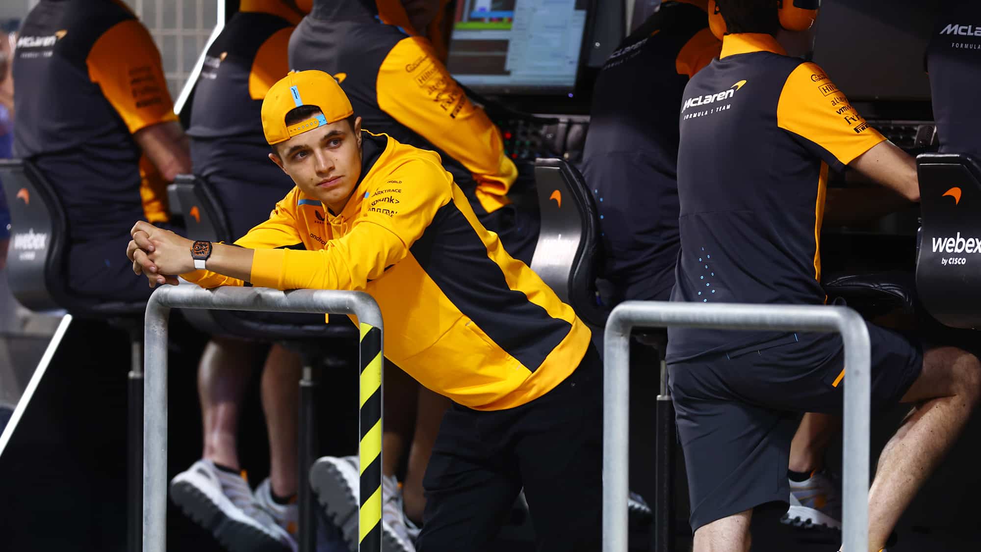 Lando Norris leans on McLaren pitwall in 2023 Bahrain testing