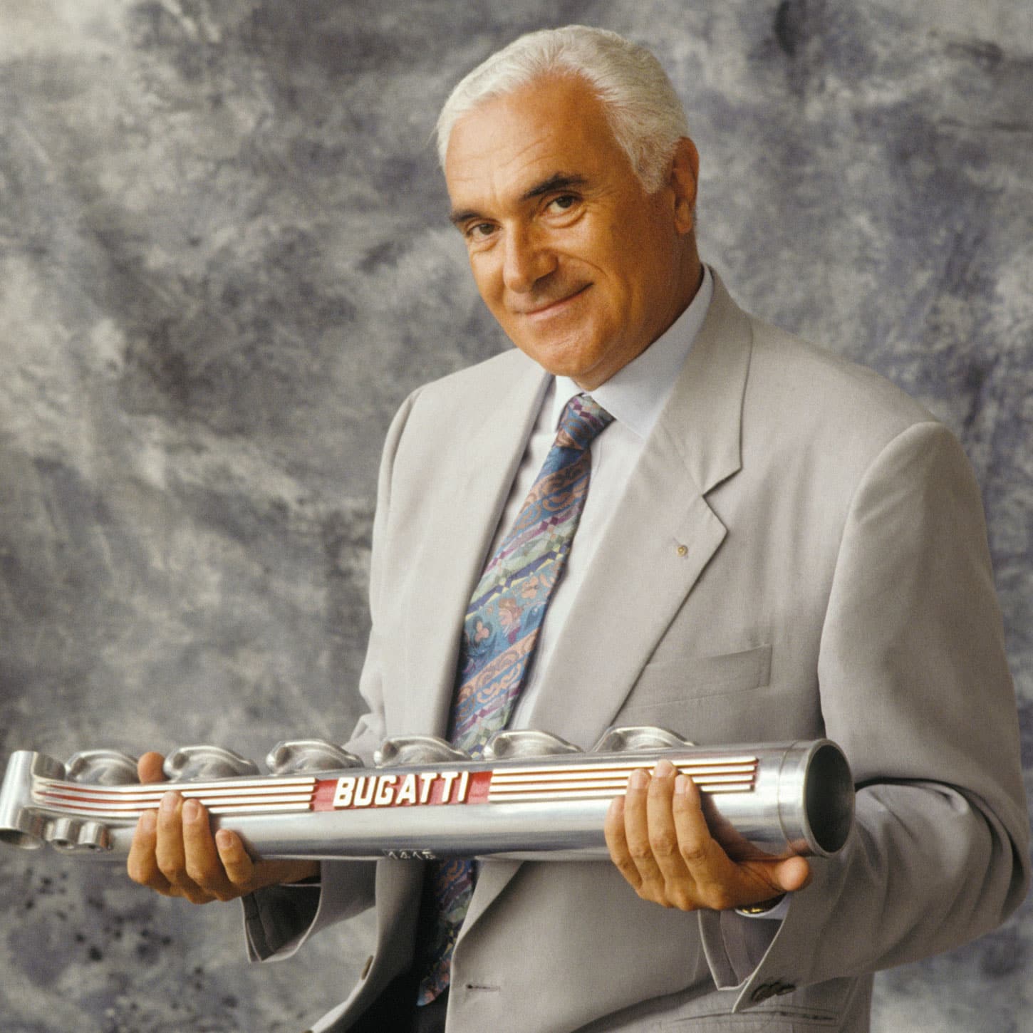 Artioli holding a Bugatti part