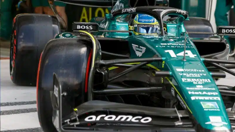 Fernando Alonso leaves Aston Martin F1 pit garage