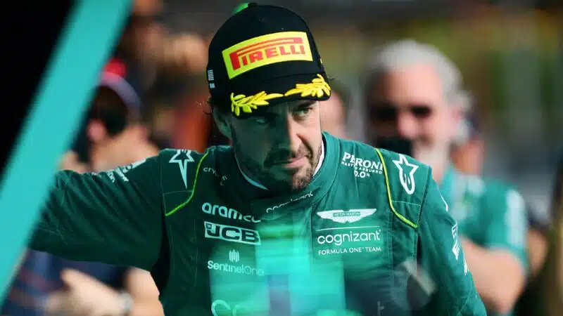 Fernando Alonso with a side glance while wearing Aston Martin F1 race suit