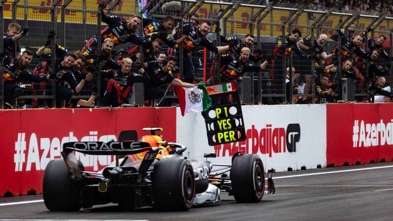 Sergio Perez drives past cheering Red Bull team as he wins the 2023 Azerbaijan GP