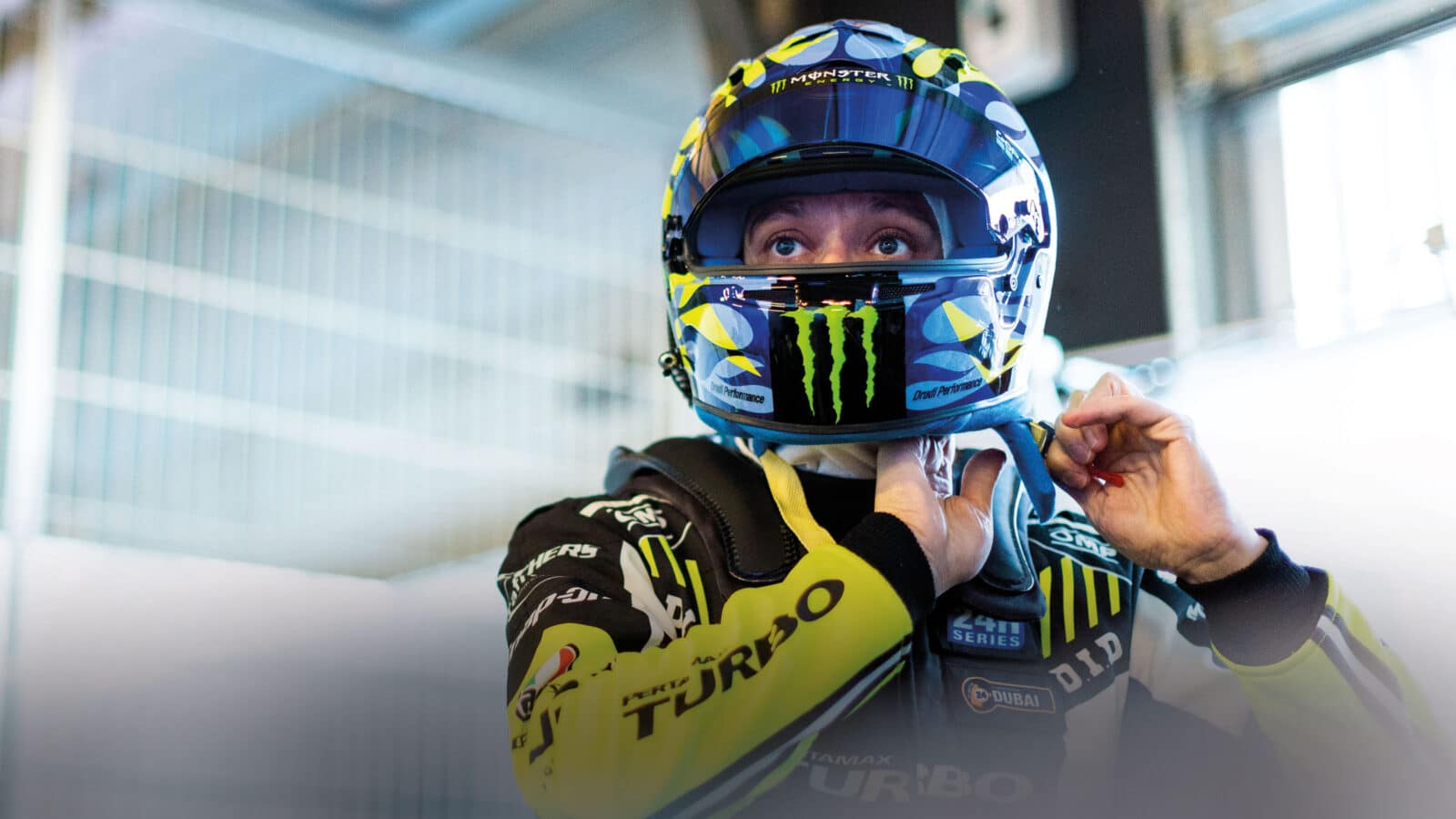 Valentino Rossi putting on helmet