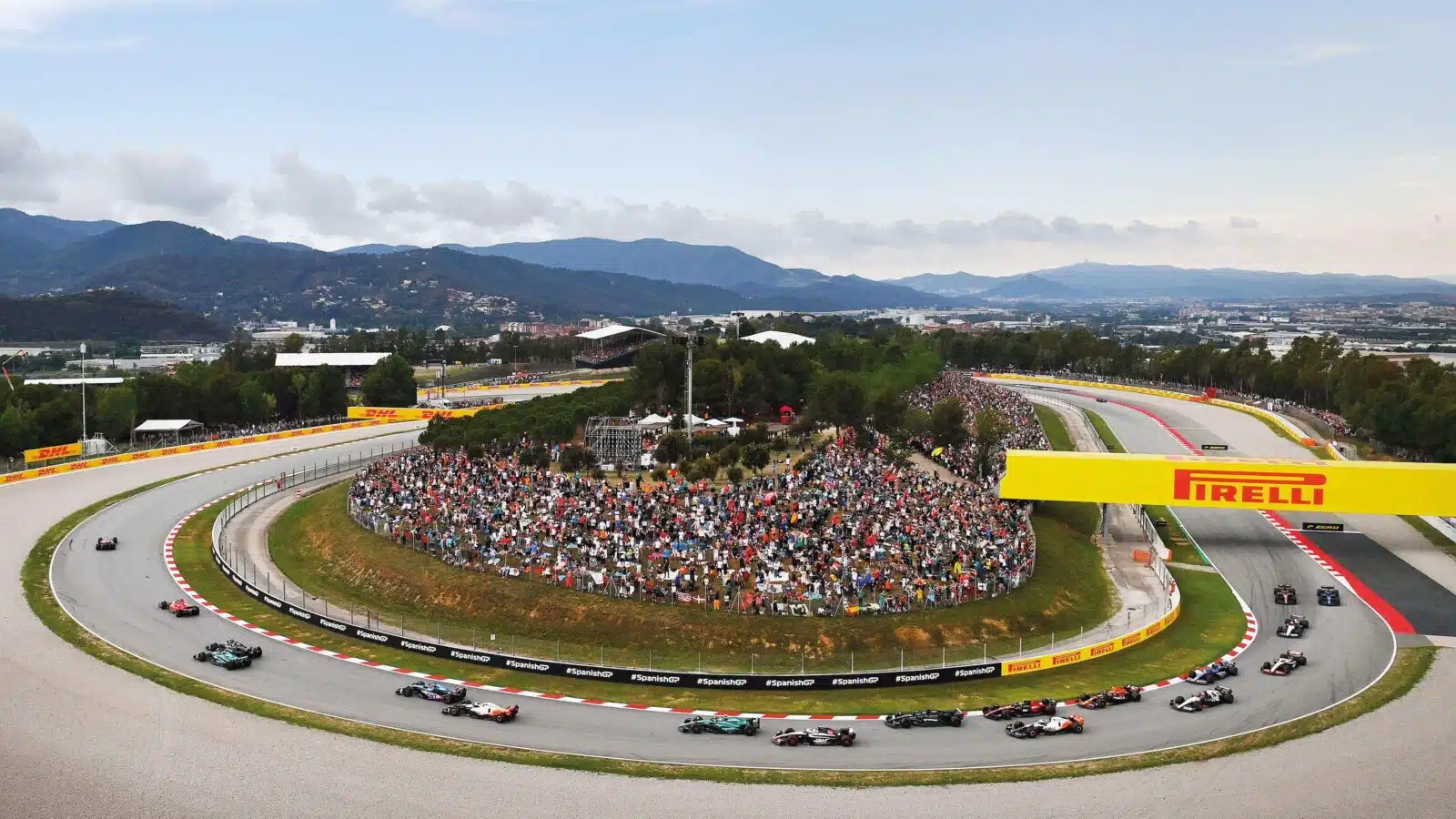 Cars come round the bend at Barcelona 2023 GP