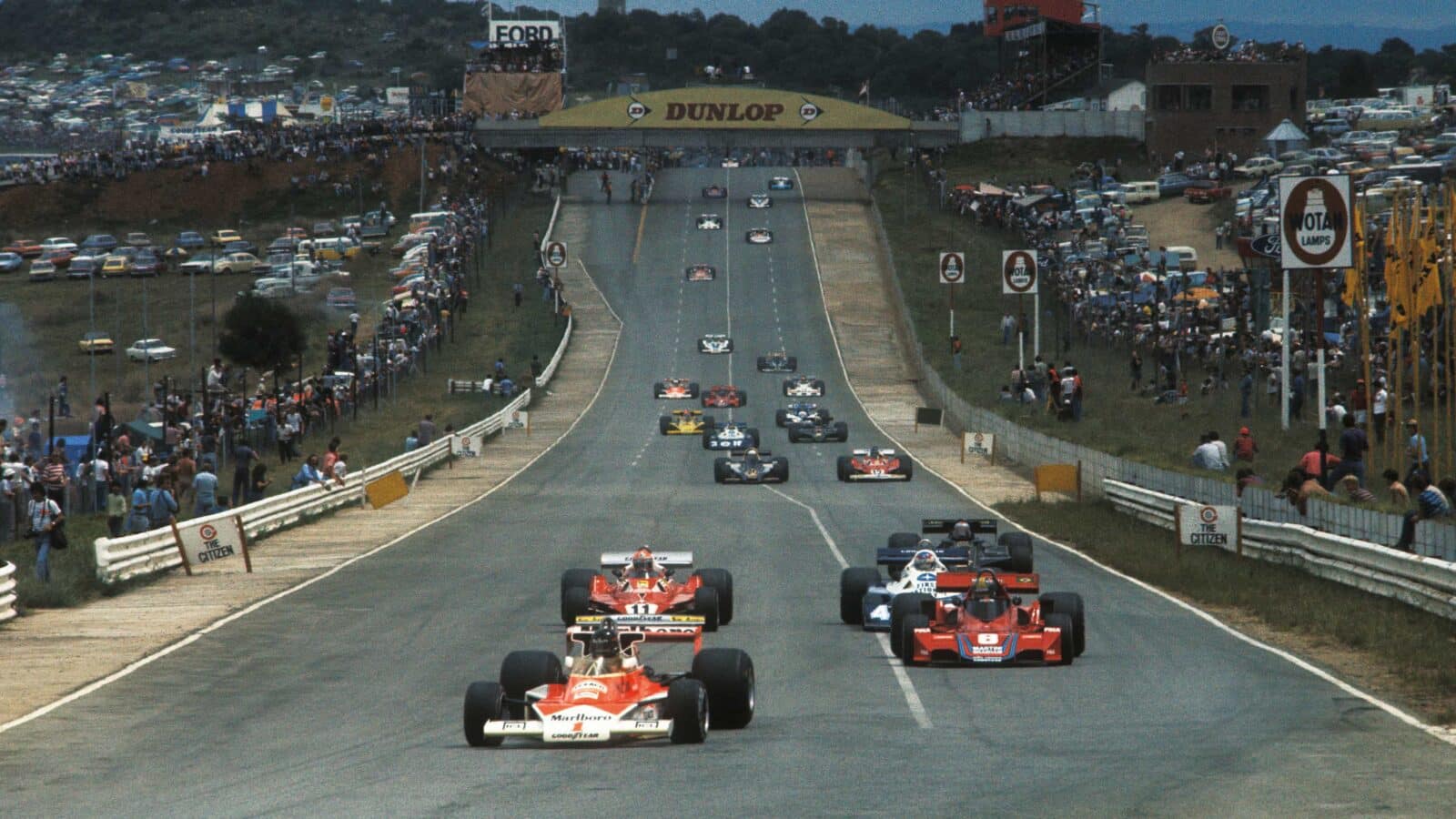 James Hunt, McLaren-Ford leads Niki Lauda and Carlos Pace at 1977 South African GP