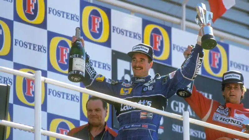 Patrick Head Nigel Mansell and Gerhard Berger on 1991 British Grand Prix podium