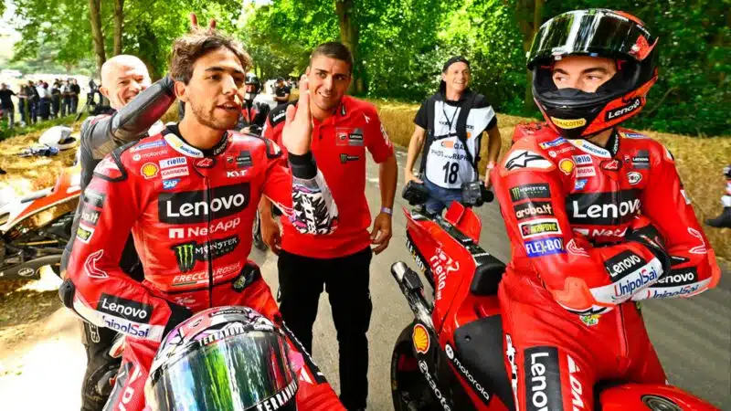 Enea Bastianini and Pecco Baganaia on the Goodwood Festival of Speed startline ahead of Mat Oxley