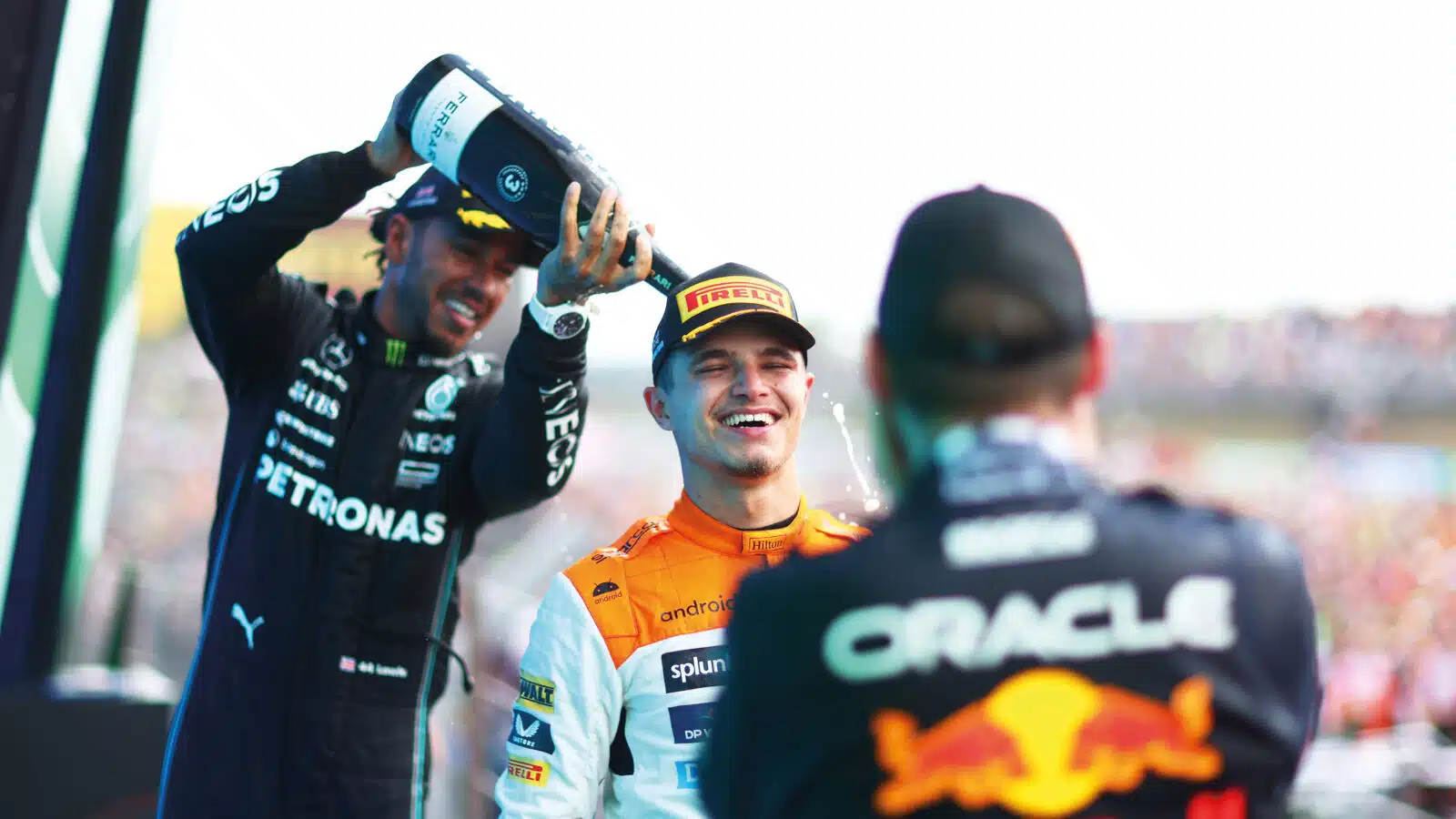 Lewis hamilton sprays Lando Norris with champagne