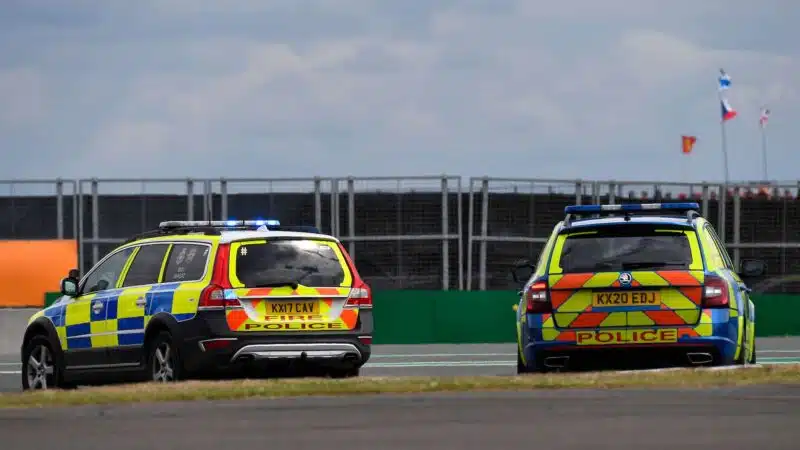 Police cars at 2022 British GP after track invasion