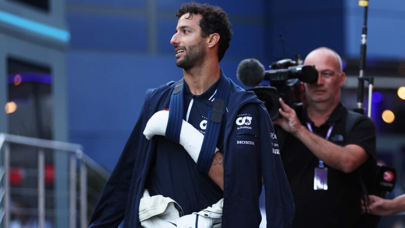 Daniel Ricciardo in 2023 Zandvoort paddock with arm in a sling