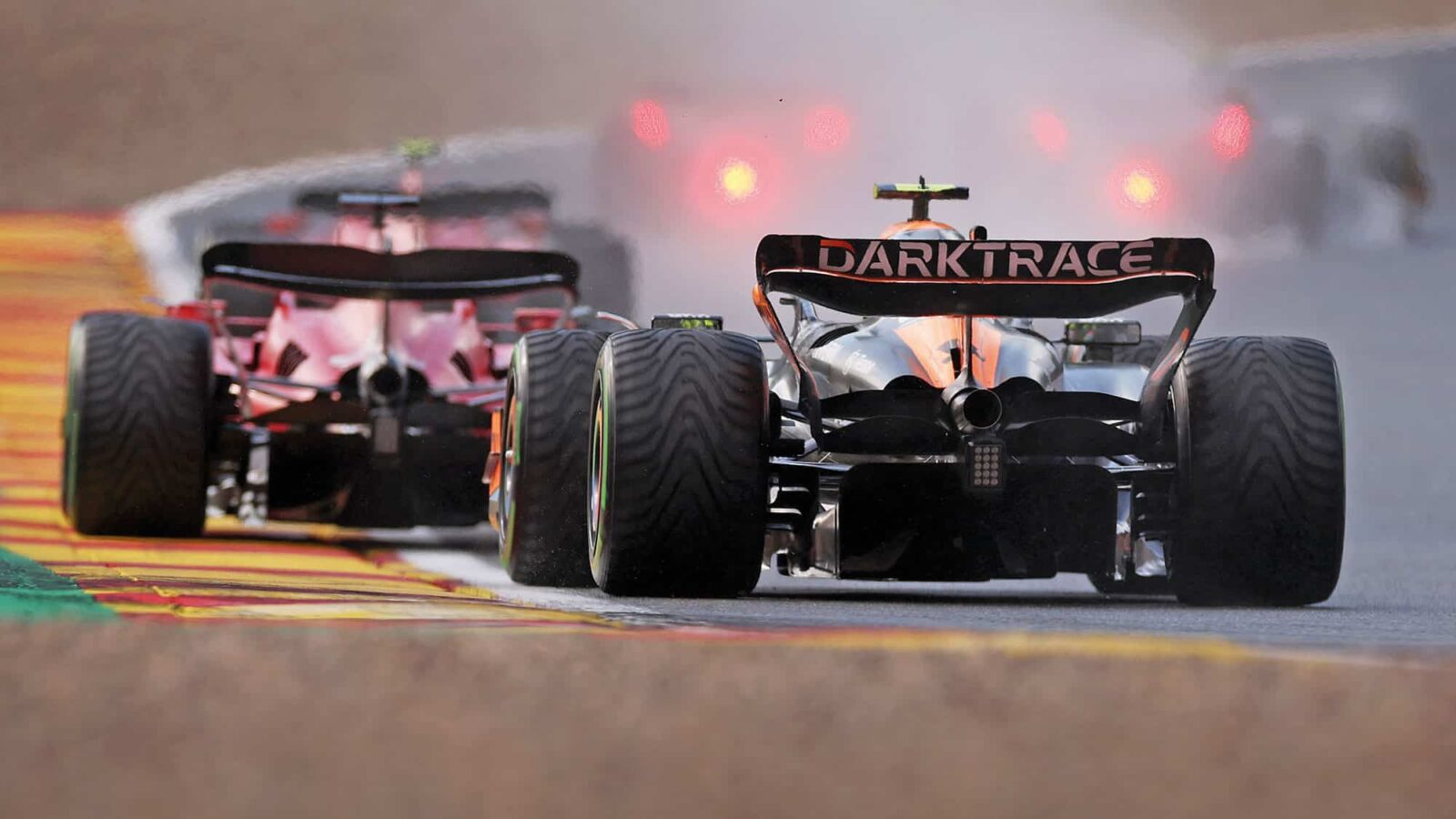 Lando Norris behind the Ferrari