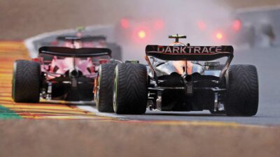 Lando Norris behind the Ferrari