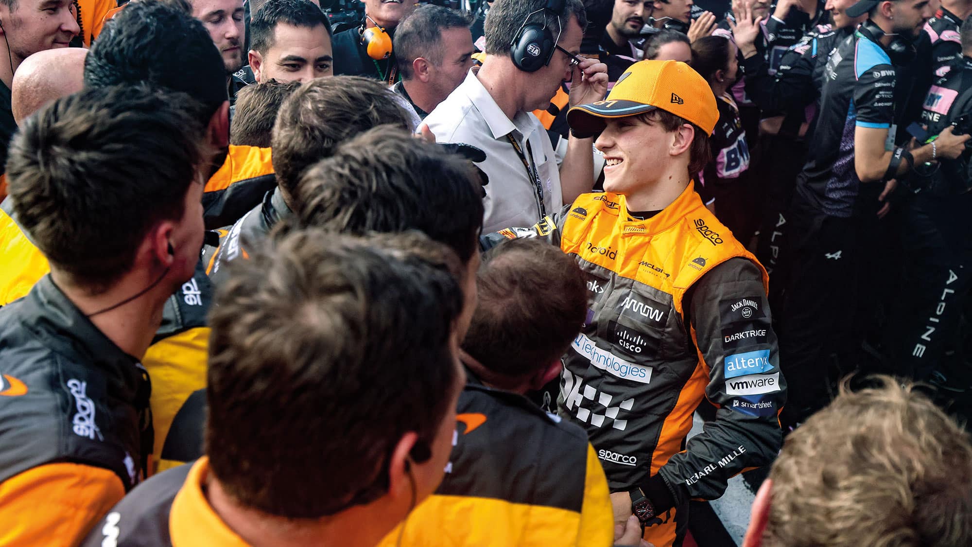 Piastri celebrates podium with team