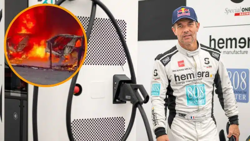 Sebastien Loeb walks between electric car chargers in Special One WRX garage