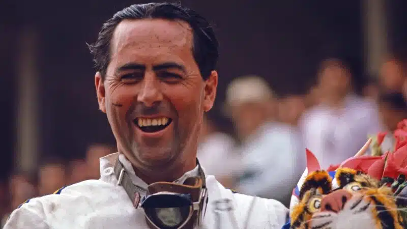 Jack Brabham celebrates victory holding soft toy tiger at the 1966 European GP in Reims