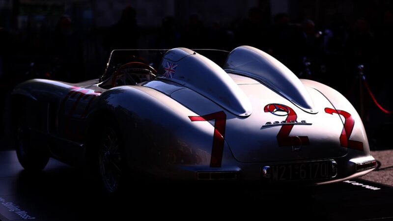 Stirling Moss 1955 Mille Miglia winnign Mercedes 300 SLR outside Westminster Abbey