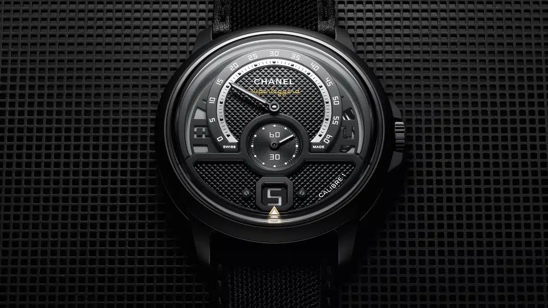 The Monsieur’s black ceramic and stainless steel case encloses a speedometer-derived dial
