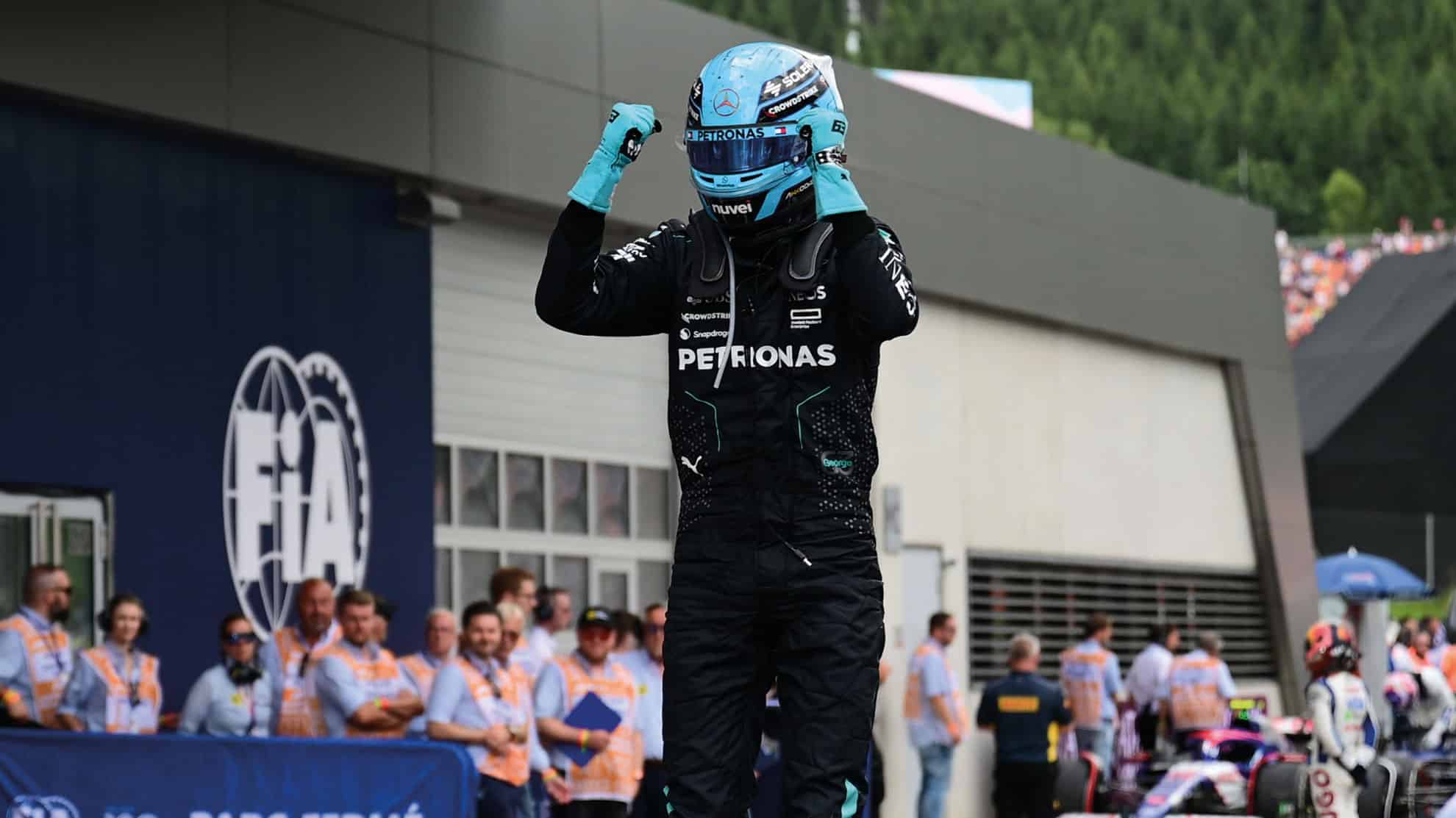 George Russell celebrates win on car