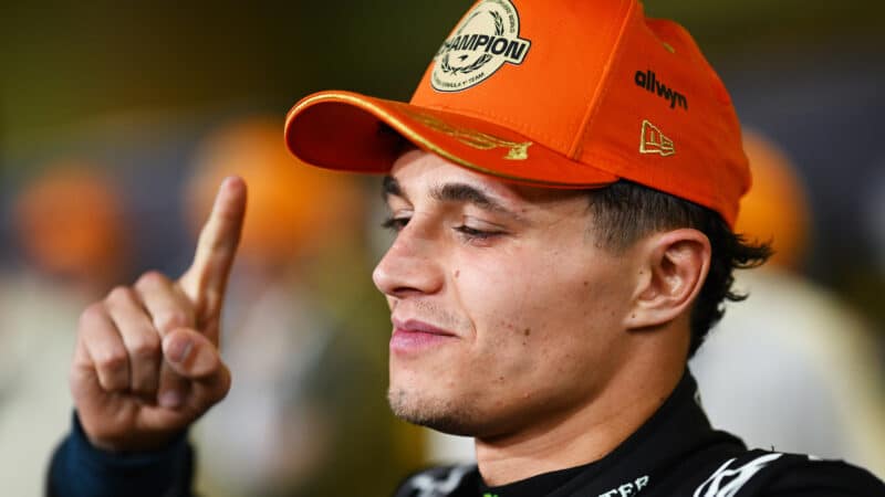 Lando Norris holds one finger up after winning the 2025 F1 world championship