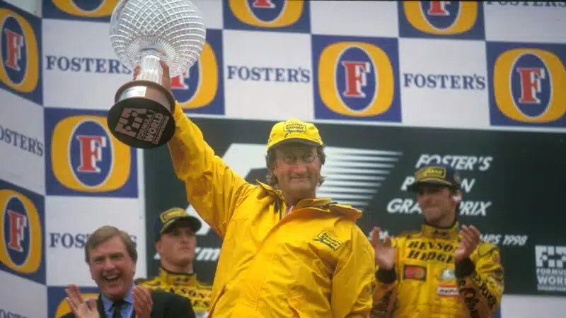 Eddie Jordan celebrates 1998 Belgian GP win on podium