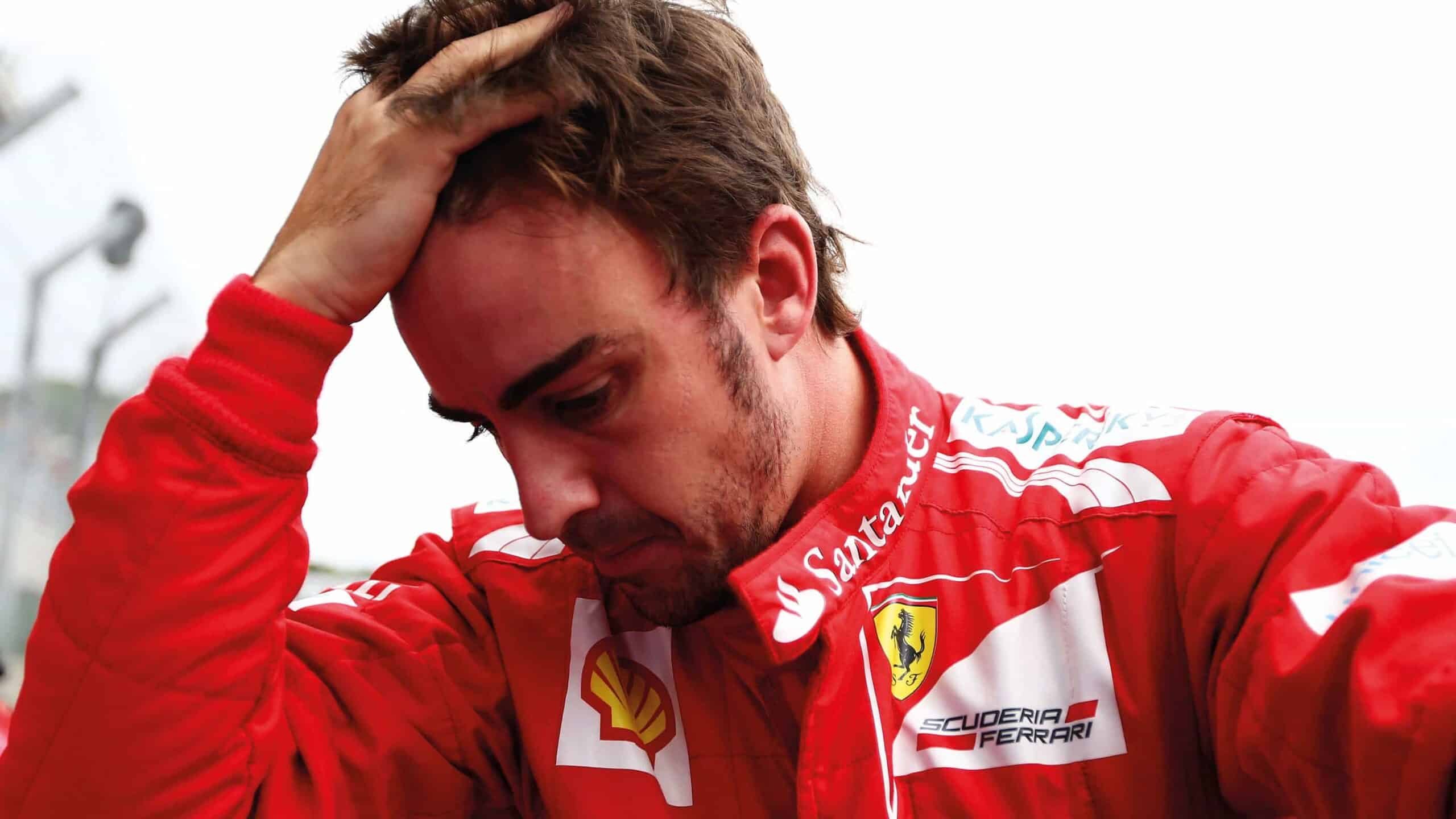 Fernando Alonso hands on head Ferrari