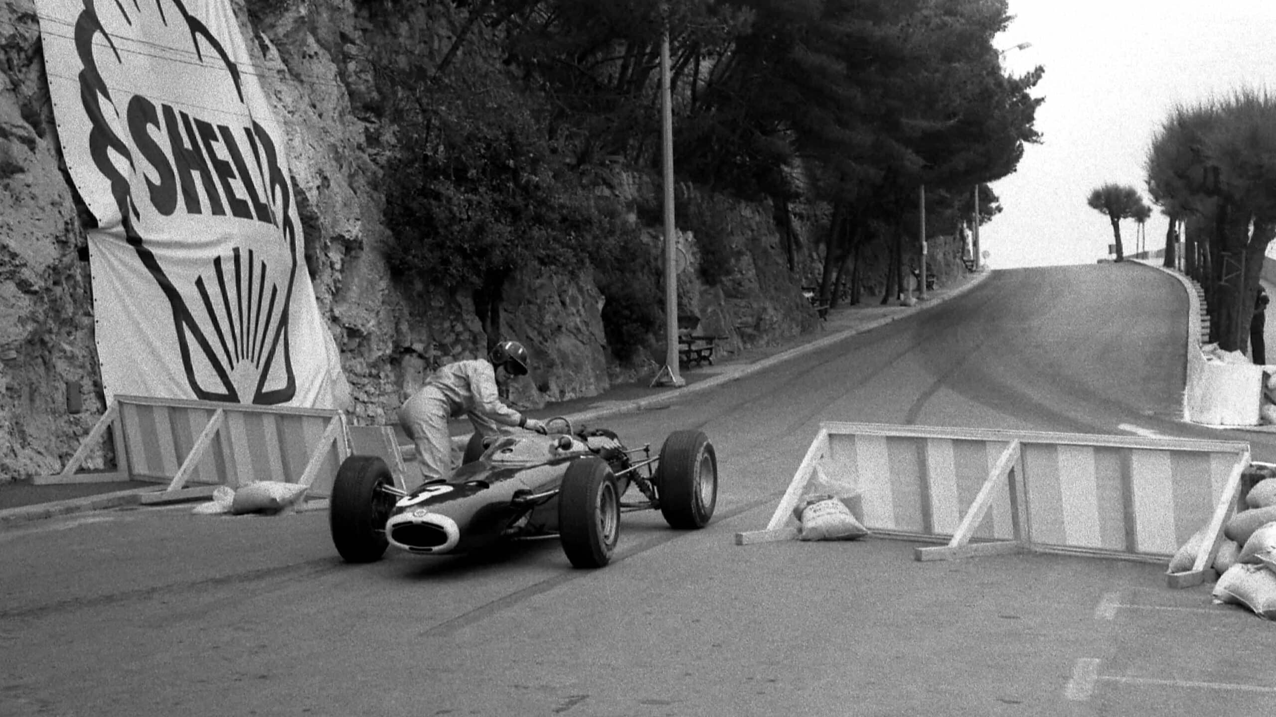 Graham Hill steps out of car 1965 Monaco GP