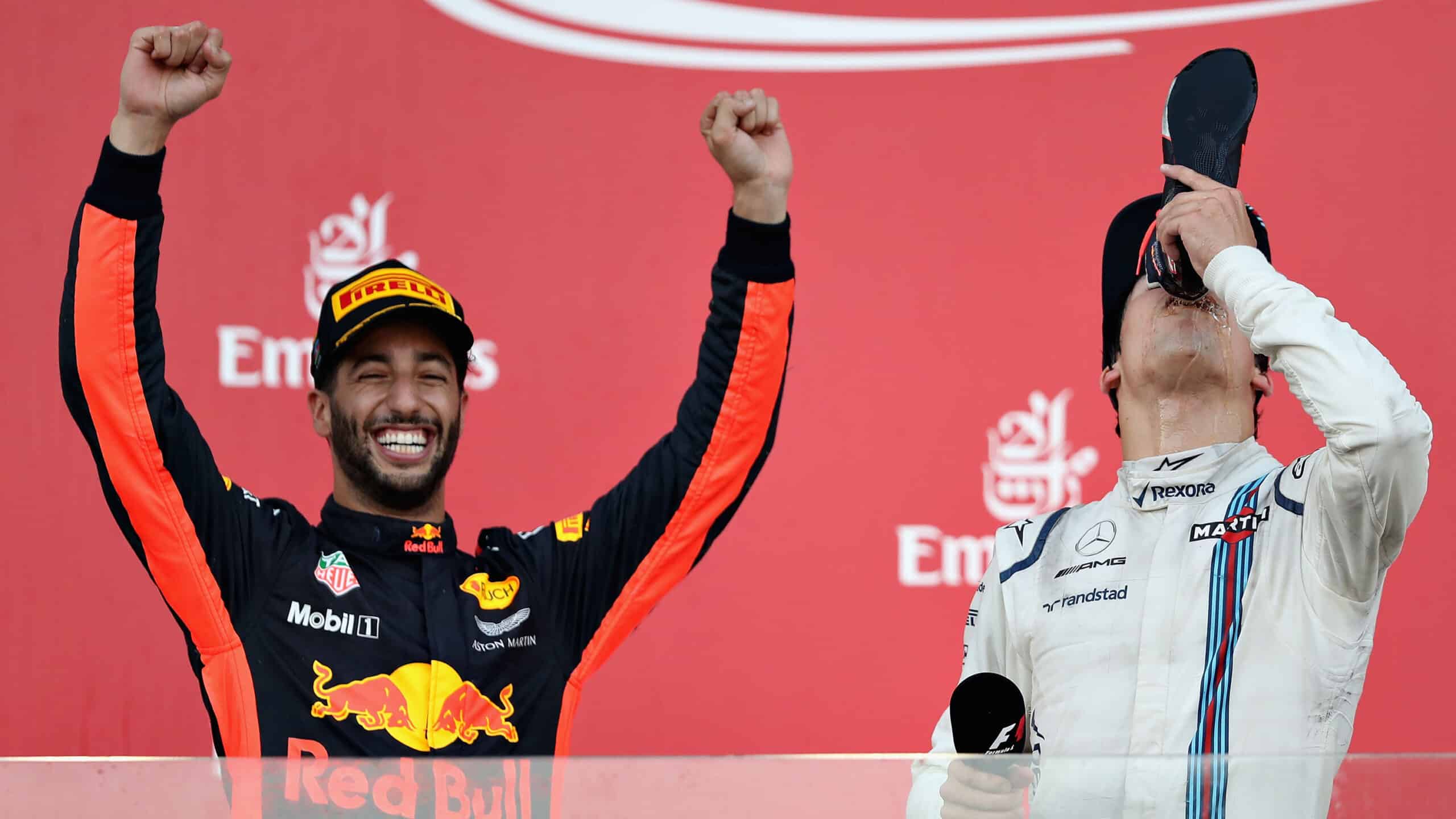 Lance Stroll does shoey with Daniel Riccardo