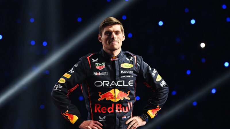 Max Verstappen puts his hand on his hips on stage at the F1 75 Live event
