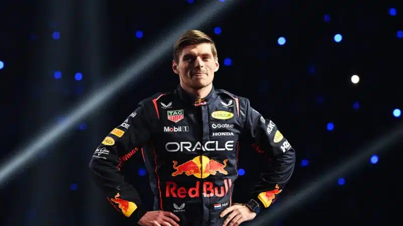 Max Verstappen puts his hand on his hips on stage at the F1 75 Live event