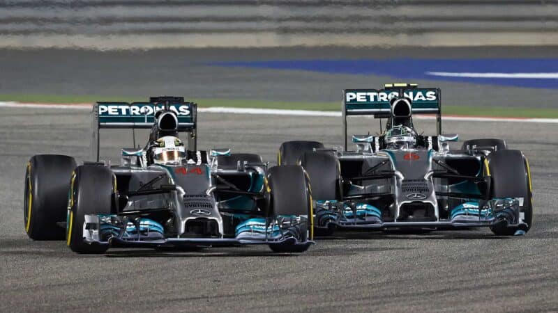 Nico Rosberg and Lewis Hamilton battle on track