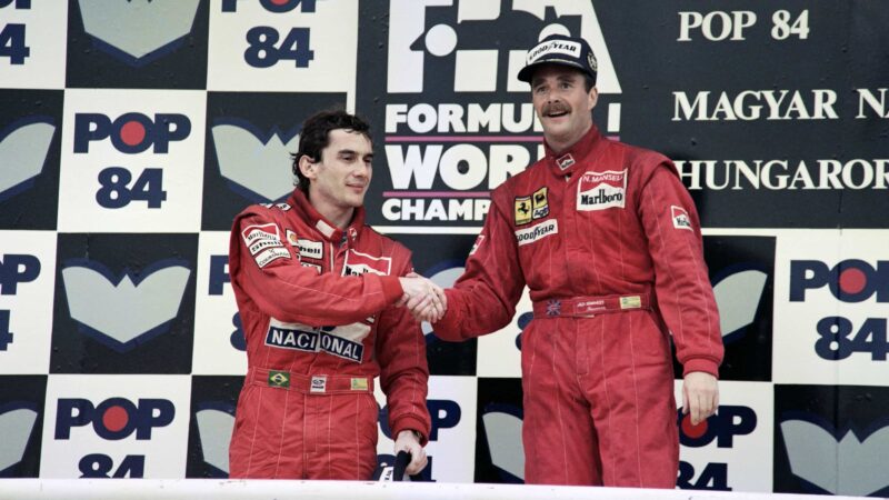 Nigel Mansell shakes hands with Ayrton Senna