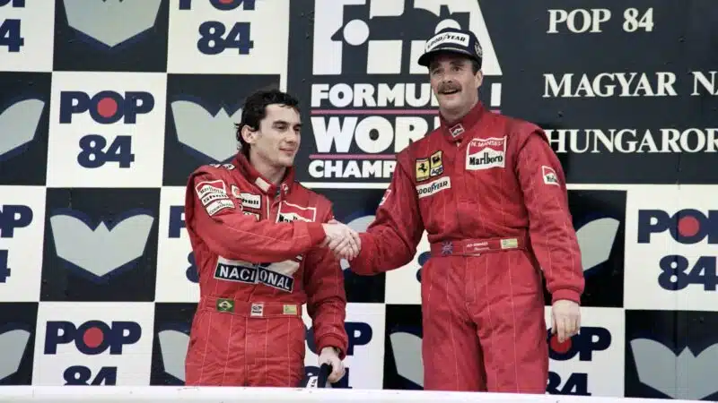 Nigel Mansell shakes hands with Ayrton Senna