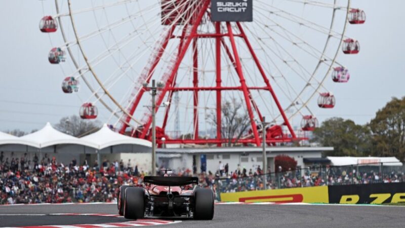 Charles Leclerc (Ferrari) seen from behind and ferris wheel during qualifying before the 2024 Japanese Grand Prix in Suzuka.
