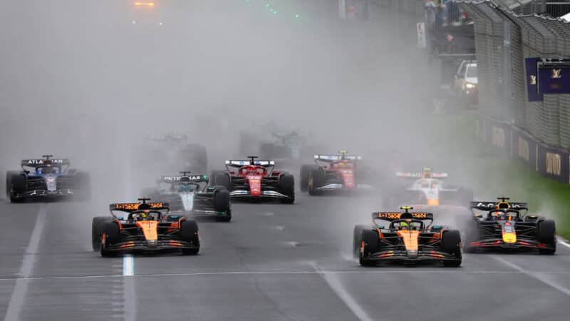 Lando Norris (McLaren-Mercedes) takes the lead at the start of the wet 2025 Australian Grand Prix