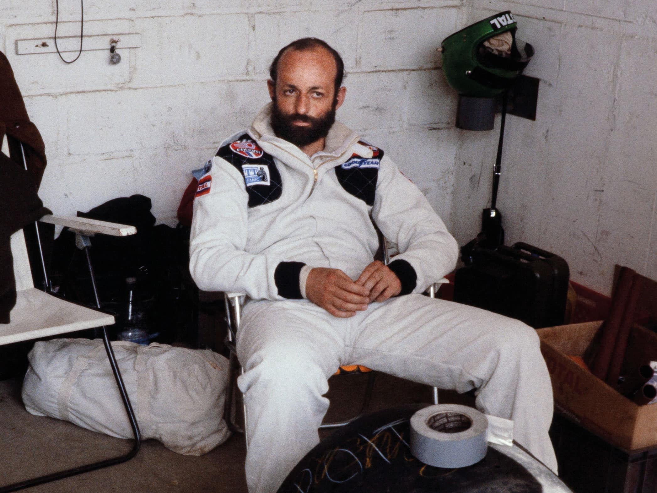 Henri Pescarolo siting in garage