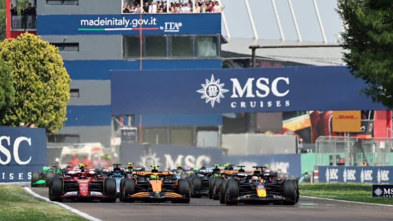 Max Verstappen (Red Bull-Honda), Lando Norris (McLaren-Mercedes) and Carlos Sainz Jr (Ferrari) leads the field at the start of the 2024 Emilia Romagna Grand Prix