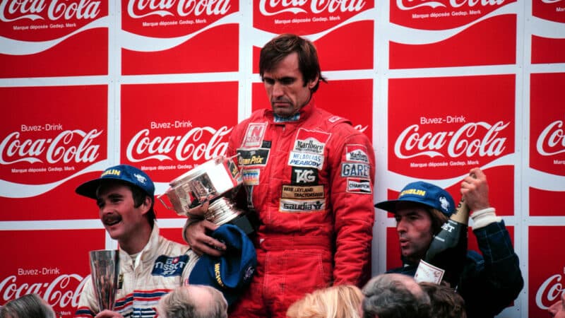 Carlos Reutemann looks sombre on the podium at the 1981 Belgian Grand Prix