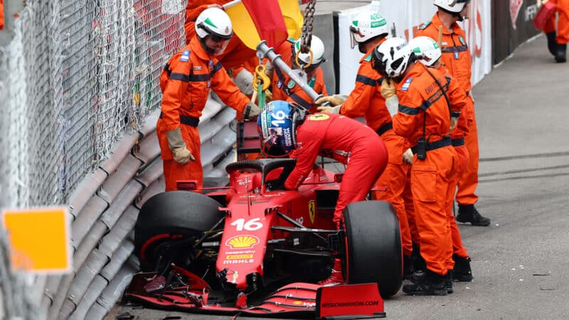 Charles Leclerc stands next to his wrecked Ferrari F1 car in 2021 Monaco Grand prix qualifying