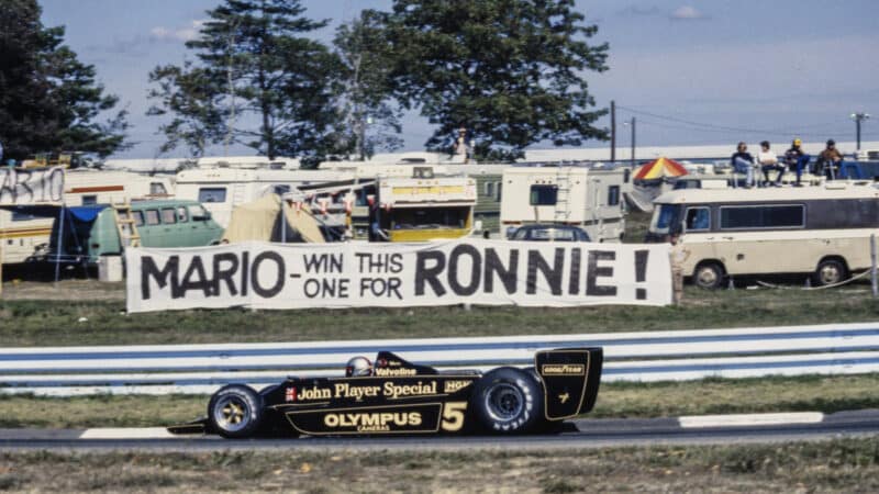 Mario Andretti, Lotus 79 Ford drives past a banner from a fan. Ronnie Peterson had died at the recent Italian Grand Prix at Monza during the United States GP at Watkins Glen International on October 01, 1978