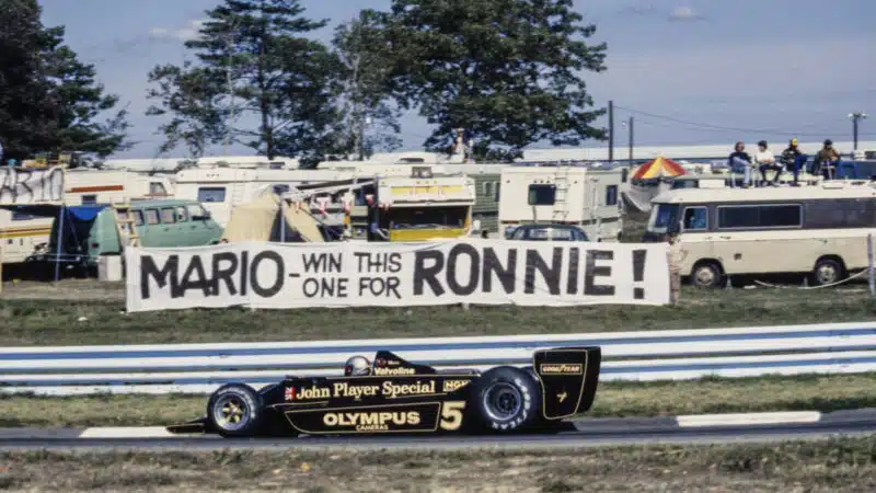 Mario Andretti, Lotus 79 Ford drives past a banner from a fan. Ronnie Peterson had died at the recent Italian Grand Prix at Monza during the United States GP at Watkins Glen International on October 01, 1978