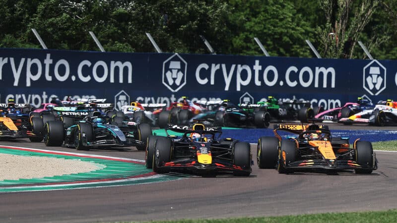 Max Verstappen takes the lead of the 2025 F1 Emilia Romagna Grnad Prix from Oscar Piastei at Imola