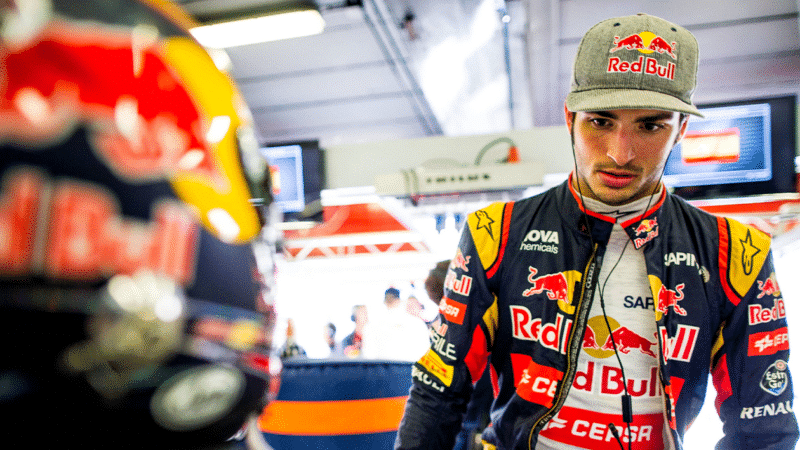 Carlos Sainz Jr prepares in his Toro Rosso garage during the 2015 season