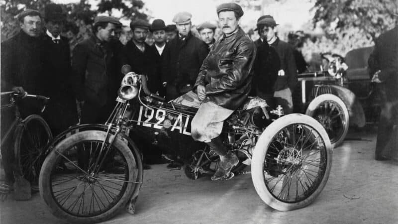French rider, French motorcycle, French race. This is Jean Osmont awaiting the start of the 1902 Paris to Vienna race aboard his De Dion Bouton trike, which was the dominant racing machine of motorcycle racing’s first era