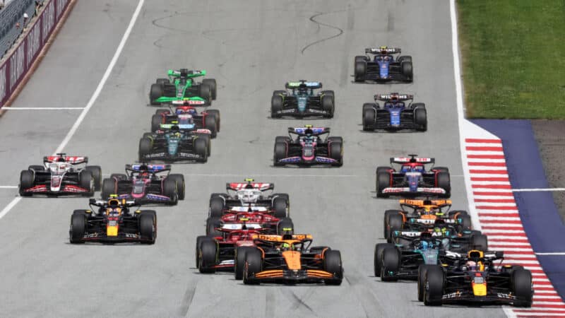 Max Verstappen (Red Bull-Honda) leads the field into the first corner after the start of the 2024 Austrian Grand Prix