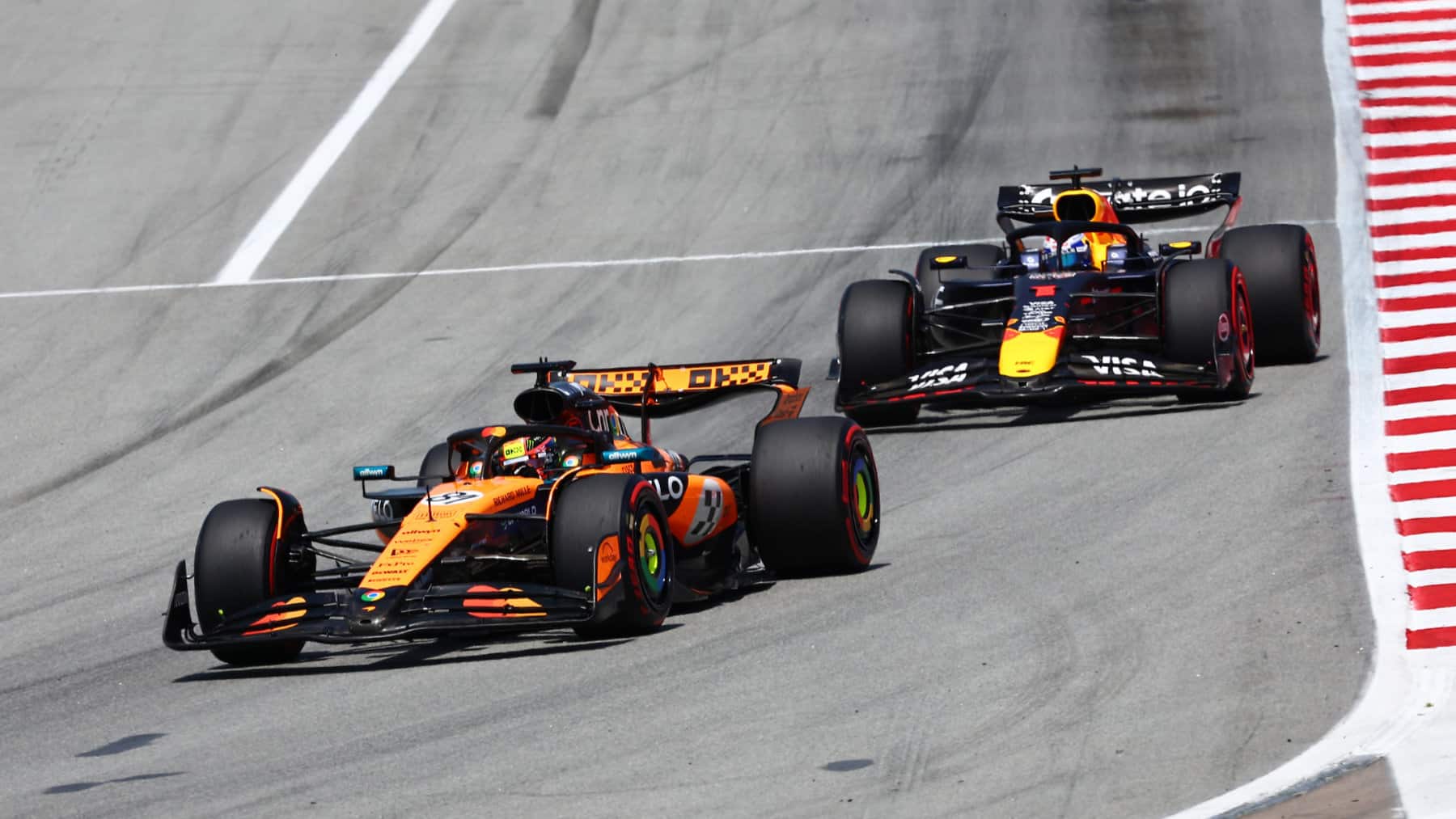 Lando Norris (McLaren-Mercedes) leads Max Verstappen (Red Bull-Honda) in the 2025 Spanish Grand Prix