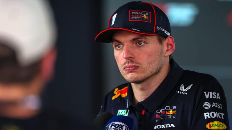 Angry looking Max Verstappen answers questions from journalists after the 2025 F1 Spanish Grand Prix