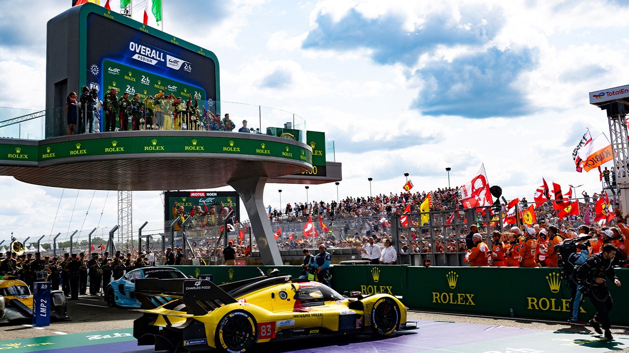 Ferrari 499P Hypercar underneath podium at 2025 Le Mans 24 Hours